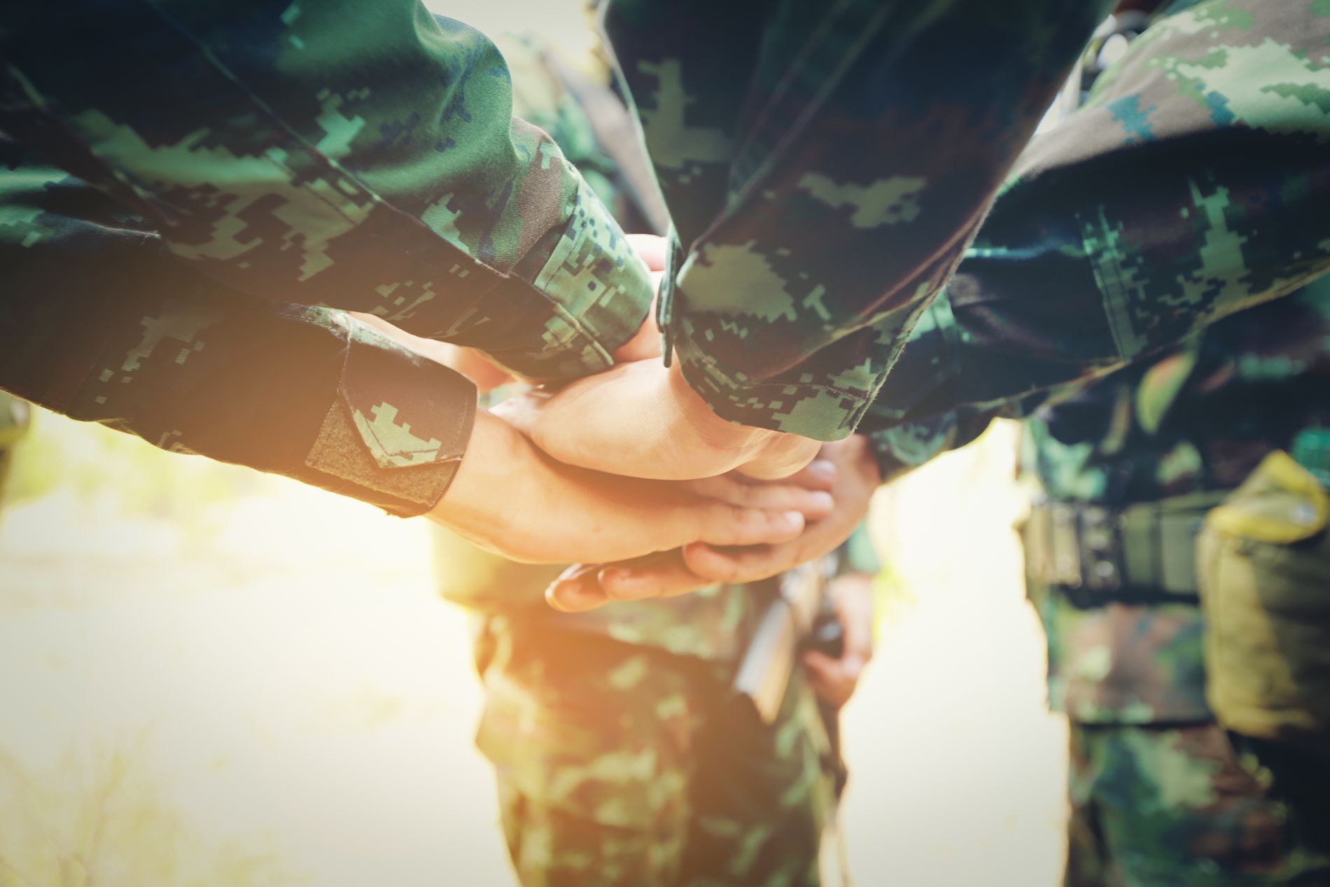 Group of Soldier Hands Together Cross Processing ready to fight